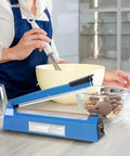 Person using 12 Inch Tabletop Impulse Heat Sealer for plastic bags with baking ingredients on the counter.