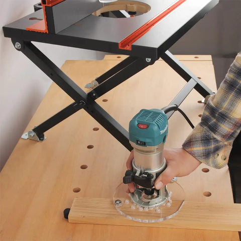 Slick Foldable Benchtop Trim Router Table With Adjustable Height Stand and Portable Workshop Station for woodworking, showing router use.