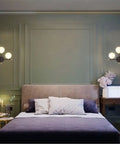 Two Light Globe Wall Sconce With Frosted Glass Globes in bedroom with cozy ambiance and mid century modern vibe lighting