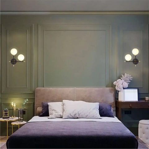 Two Light Globe Wall Sconce With Frosted Glass Globes in bedroom with cozy ambiance and mid century modern vibe lighting