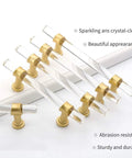 Acrylic Drawer Pulls Set in Gold Brushed Brass Finish for Cabinets and Dressers, T Bar design, angled view showing 6 pulls in package.