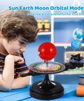 Hands On Solar System Model With Light For Kids And Teens, Totally Kid Friendly Orrery That Demonstrates Sun Earth Moon Dynamics In A Fun Planetarium Science Kit. Boy viewing plastic solar system model on desk