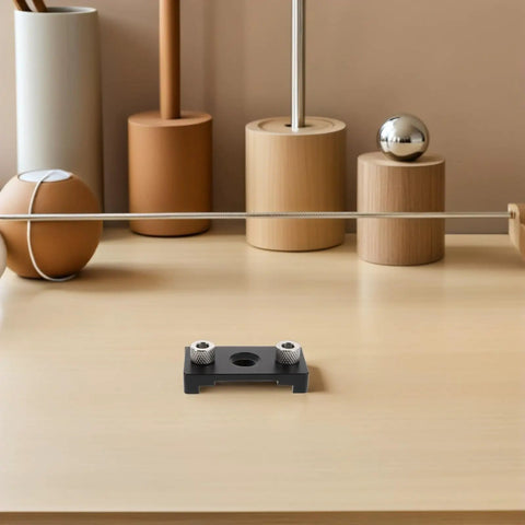Adjustable Dowel Jig Kit With Precision Drill Guide Locator For Woodworking shown on a minimalist desk with decorative items.