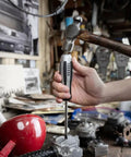 Hand holding a Vessel screwdriver in workshop, showcasing Impact Wrench 2 Piece Set Built Tough For Real World Jobs With User First Design.