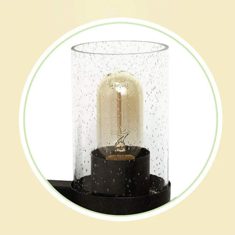 Close-up of seeded glass shade on Industrial Three Light Vanity Fixture With Seeded Glass Shades 18.9 Inch Rustic Farmhouse Vibe Wall Sconce In Black And Brown Vintage Edison Glow With Oak And Metal Backplate For A Sturdy Timeless Look.