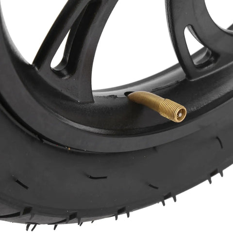 Close-up of 12 Inch Electric Scooter Tire with Wheel Hub Rubber Tyre Replacement 12 1/2 X 2 1/4 showing valve and tread detail.