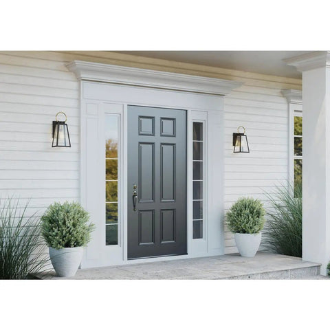 Barnett Outdoor One Light Wall Lantern In Antique Bronze Finish mounted beside a front door, enhancing the farmhouse exterior décor.