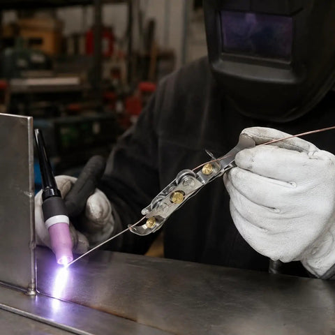 Ultimate TIG Wire Feeder Tool With Magnetic Base And Heat Shield For Alloy Filler Rods guiding wire during TIG welding process.