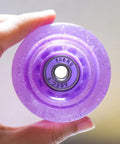 Close-up of 4 Pack Purple Dope Roller Skate Wheel 82A High Elastic PU for Outdoor Quad Skates Replacement Parts Non Light Up Decorative Wheel