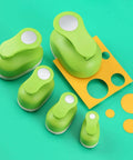 Set of green circle punches with lever handle for clean even circles, perfect for various crafts projects and paper sizes.