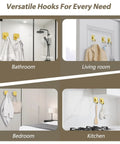 Heavy Duty Adhesive Wall Hooks In A Dope Four Pack, Stainless Steel Stick On Hangers With Badass Grip For Bathrooms And Kitchens, Waterproof And Super Fast To Put Up On Any Wall Or Door Without Drilling, Classic Gold Finish in bathroom, living room, bedroom, and kitchen.