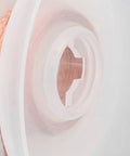 Close-up of Pro Grade Premium Solder Wick Desoldering Braid spool, showcasing high absorption copper wire for electronics repair.