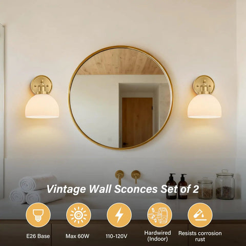 BELVM Vintage Milk Glass Wall Sconce Set of 2 - Gold Bathroom Wall Lights beside a round mirror in a stylish bathroom.