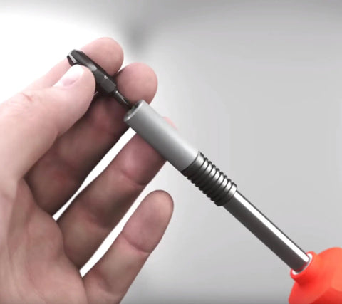 Hand holding a magnetic precision driver from 26InOne Ultra Driver Set 14 Piece Kit With Magnetic Bits And Precision Screwdrivers For Home Auto And Workshop Use Built Tough Versatile Hand Tool Collection.