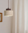 Modern Mini Pendant Light, Travertine Stone Light Fixture with Wooden Accent, hanging above a curtain and framed art.