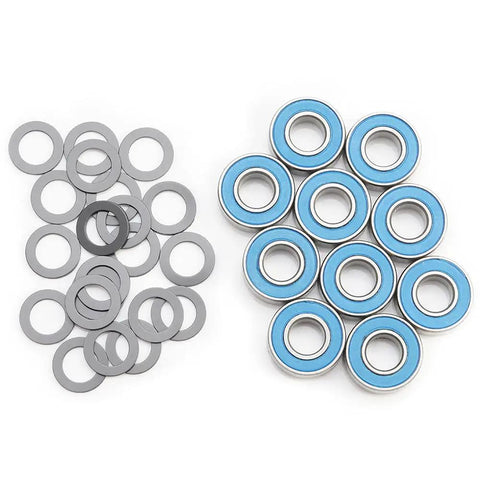 Five Pack 5116 Ball Bearings With Blue Rubber Seals And 1985 PTFE Coated Washers For RC Cars, bearings and washers displayed.