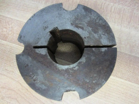 Top view of Dodge Taper Lock Bushing 1 Inch Bore Inner Diameter 1 Inch Outer Diameter 2-1/2 Inch Thick 1-1/4 Inch Surface Rust Industrial Grade