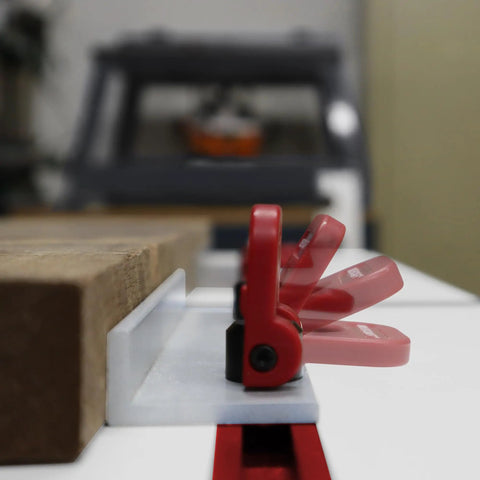 Close-up of Dead Simple Quick Swap Cam Stops for Router Tables with T Track Clamps, low profile aluminum design.