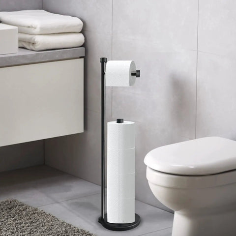 Matte Black Freestanding Toilet Paper Holder With Reserve Storage For Five Mega Rolls beside toilet in bathroom