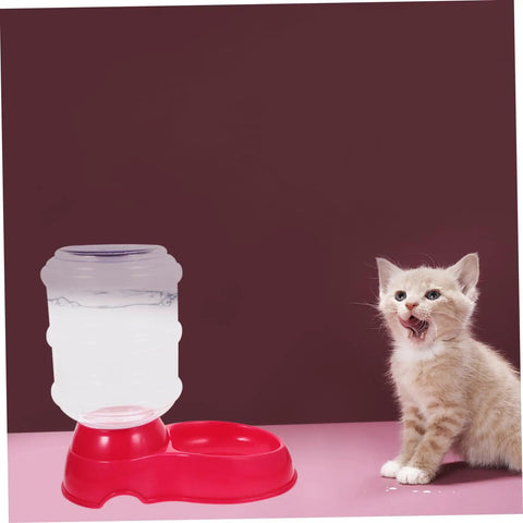 Chill Out As Your Furry Buddies Chow Down On This Pink 3.5L Automatic Pet Feeder And Water Bowl Station Featuring A Tight Leak Proof Cap And Grippy Non Slip Bottom next to a cat.