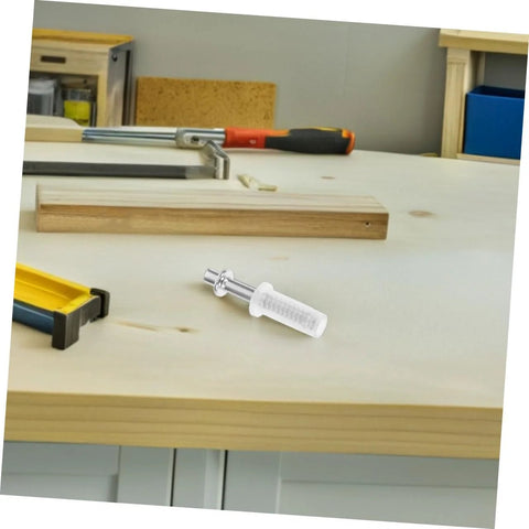 Close-up of a silver metal pivot hinge pin with a white plastic spacer for bifold closet door hardware.