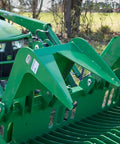 72 Inch Grade 50 Skeleton Rock Grapple Bucket For Tractors With Open Tine Design, attached to a green John Deere tractor.