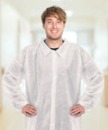 Man wearing 50 Pack Disposable Lab Coats For Adults White Large Bulk With Knitted Cuffs And Collar Ideal For Science Labs Medical Testing