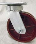 Hella Tough 6 Inch Ductile Steel Swivel Caster, kingpinless design, bright red wheel, 1500 lbs capacity.