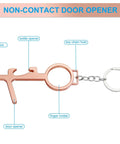 Eight Piece No Touch Door Opener Tool With Stylus Keychain Reusable Multifunction Button Pusher And Bottle Opener in rose gold.