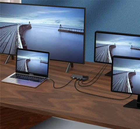 Sleek Usb C Docking Station For Triple Monitors With Usb 3.0 Ports And Dual Card Slots In Heavy Duty Aluminum Build connected to laptop and displays.