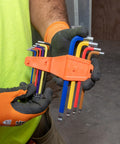 Long Ball End Hex Key Wrench Set With SAE And Metric, L Style, color coded 19 piece kit in orange holder, held by gloved hands.