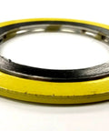Spiral wound gasket, yellow outer ring with metal inner ring for pipe flange.