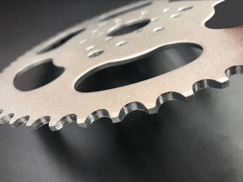 Close-up of High Performance 56 Tooth Chain Sprocket With Three Hole Six Hole Nine Pattern For 415 And 415H Chain On Gas Motorized Bicycle