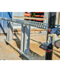 Using 18V Connected Ready Two In One Impact Driver And Socket Wrench Kit With One Quarter Inch Hex And One Half Inch Drive on metal pipe