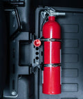 Slick Under Seat Fire Extinguisher Bracket For Ineos Grenadier Truck with secured red fire extinguisher and aluminum mount.