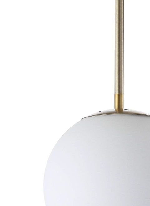 Close-up of Dope White And Brass Modern Globe LED Pendant Light for Kitchen Island, featuring white glass globe and brass rod.