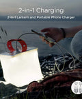 Two In One Solar Camping Lantern And Phone Charger glowing on a blanket during outdoor adventure.