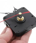 Hand holding Quartz Long Shaft Clock Movement Replacement Kit with brass nut and red hands for DIY wall clock repair.