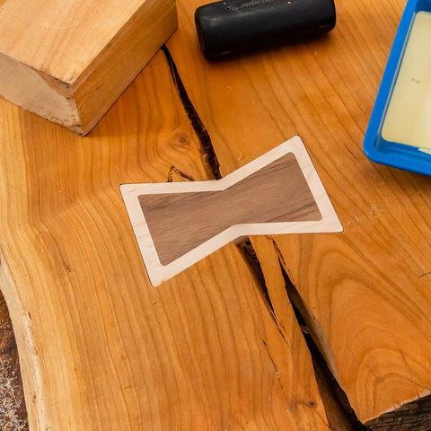 Close-up of Bow Tie Inlay Kit With Frame, Bit, And Bushing For Precise Router Inlays And Decorative Woodworking Templates