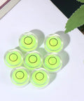 10pcs Circular Bubble Spirit Level for Calibration Picture Frame arranged with bright green liquid in transparent acrylic.