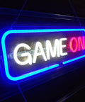 Blue Neon Gaming Sign Dimmable USB Powered Wall Decor for Game Room Bedroom and Man Cave LED "Game On" sign hanging on wall.