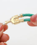 Close-up of 50 Pack Double Spade Wire Connectors For Motorcycle Wiring, 2 To 1 Splice, 4mm Bullet Crimp Terminals, transparent sleeve