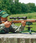 Shooter using Ambidextrous Front Rifle Rest with Adjustable Height for range time sight in, durable cast aluminum base visible