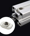 Close-up of 50 Pack Hammer Head Sliding T Nuts For 8mm T Slot Aluminum Extrusion 3030 Series M6 Thread Slide In Easy Insertion And Strong Connection Fits Standard Profiles Rierdge inserted in aluminum profile