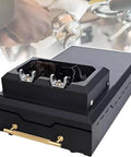 Slick Automatic Coffee Grounds Cleaner And Electric Portafilter Wiper Knock Box showing dual cleaning heads and detachable handle.