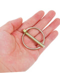 8 Piece Heavy Duty Lynch Pin Set With Spring Retainer Rock Solid Locking Pins For Trailers Mowers And Equipment Built To Last For Enhanced Durability And Safety Easy To Install And Keep Your Gear Locked In. metal lynch pin with spring retainer in hand