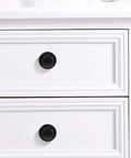 Super Sleek Four Pack Retractable Spring Loaded Cabinet Knobs on white drawers, black zinc alloy, 30x30x25mm.