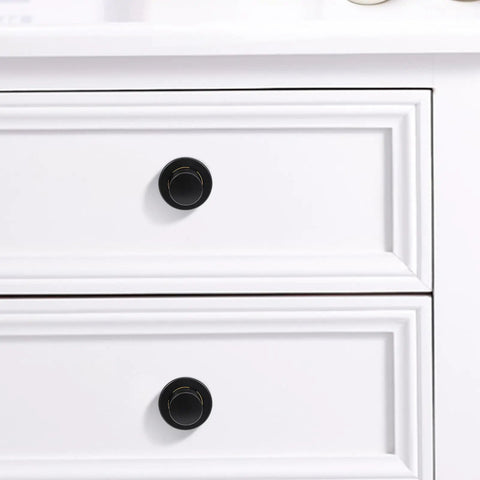 Super Sleek Four Pack Retractable Spring Loaded Cabinet Knobs on white drawers, black zinc alloy, 30x30x25mm.