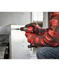 M12 Fuel Cordless Hammer Drill Kit Delivering Knockout Torque And Slick Grip Handling Crushes Through Concrete And Lumber Like Badass Power Perfect For Pro Grind Days And Weekend Workshops Requiring Zero Hassle Maximum Reliability, used on a metal surface.