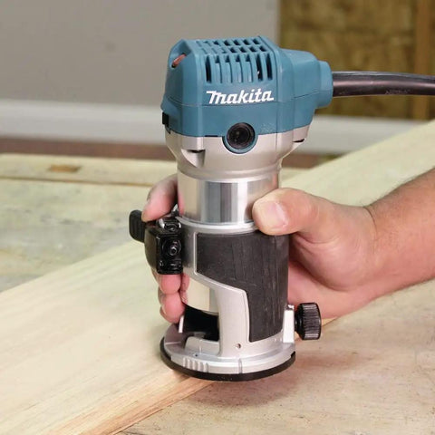 RT0701CR 1-1/4 HP Compact Router with variable speed, ergonomic grip, used on wood for precise cuts, cabinetry and trim work